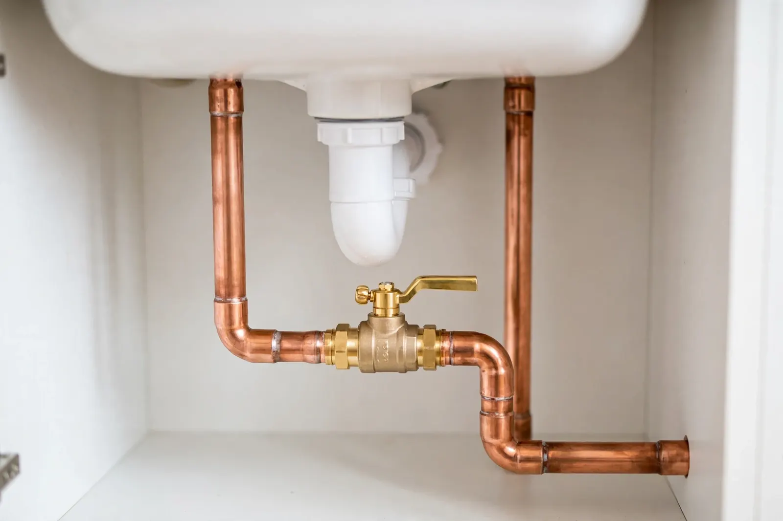 New copper pipes and a shutoff valve, freshly installed